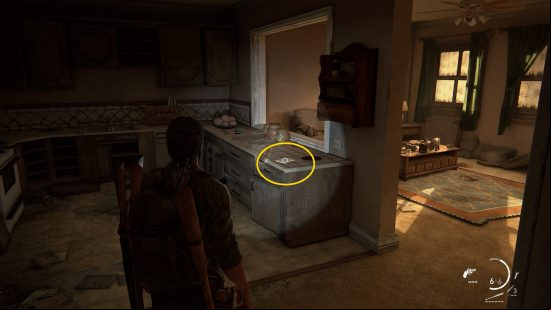 The Last of Us training manuals: a man shines his flashlight on a countertop.