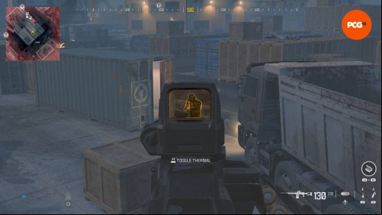How long is MW3 campaign: A player is aiming down their scope at an enemy aiming their gun right back at them. They're in some kind of cargo storage facility.