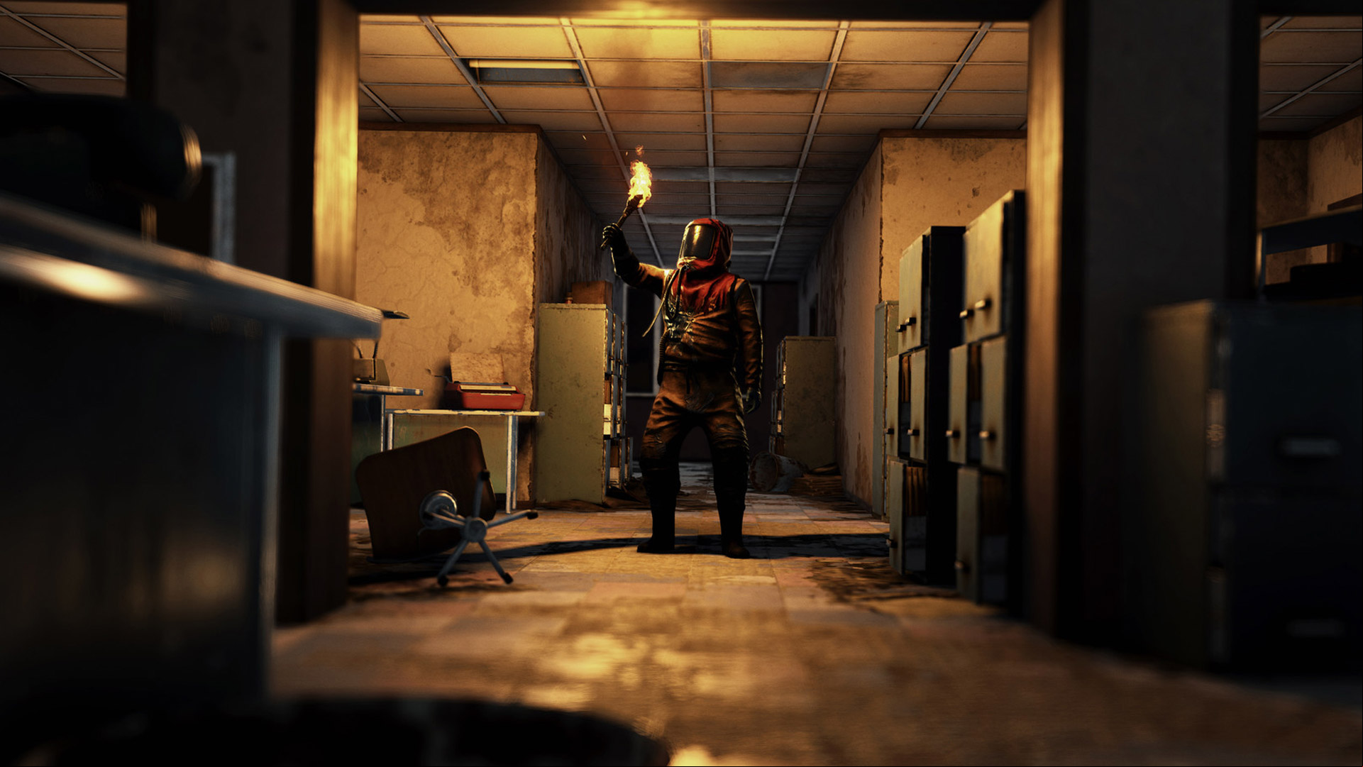 Rust console commands how to use: a person in a hazmat suit holding a torch in a dimly-lit building