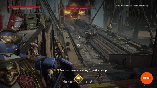 Space Marine 2 builds: A Heavy aiming at a horde of Terminids charging across a bridge towards the player.